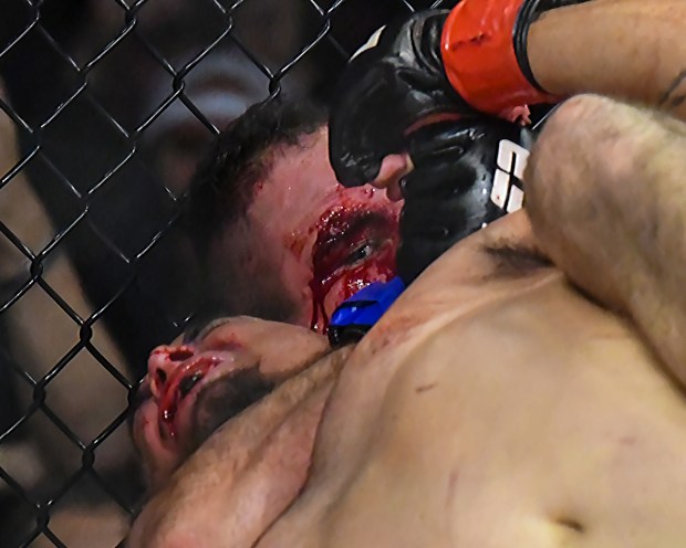Mixed martial artist, Lorenzo Figueroa, bottom, from Santa Cruz, fights Billy Ray Valdez at League Fighting Alliance 165 at Kaiser Permanente Arena in Santa Cruz. (Raul Ebio - Santa Cruz Sentinel file)
