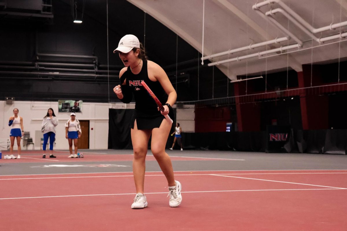 NIU women’s tennis then-sophomore Lucia Yecora celebrates a point  on Feb. 15. Yecora reached 102 combined career wins, the 20th NIU player to break 100 wins. (Northern Star file photo)