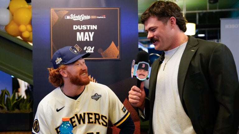 Boston Red Sox pitcher Payton Tolle, right, interviews Milwaukee Brewers pitcher Dustin May during a World Series baseball media day, Thursday, Oct. 22, 2026, in Milwaukee, ahead of Game 1 between the Milwaukee Brewers and the Tampa Bay Rays.
