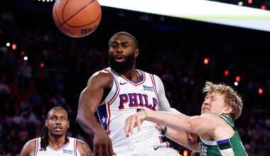 Jaylen Brown fights for a loose ball with Milwaukee Bucks guard Kasparas Jakucionis in the third quarter on Saturday,