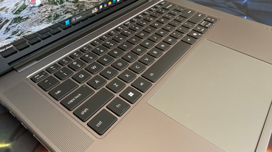 The Yoga Pro 7i photographed from above, with backlit keyboard and trackpad in full view.