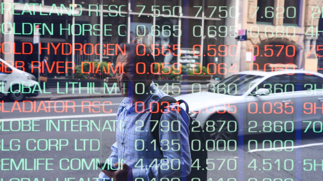 ASX 200 avoids global carnage as banks, retailers offset AI fears