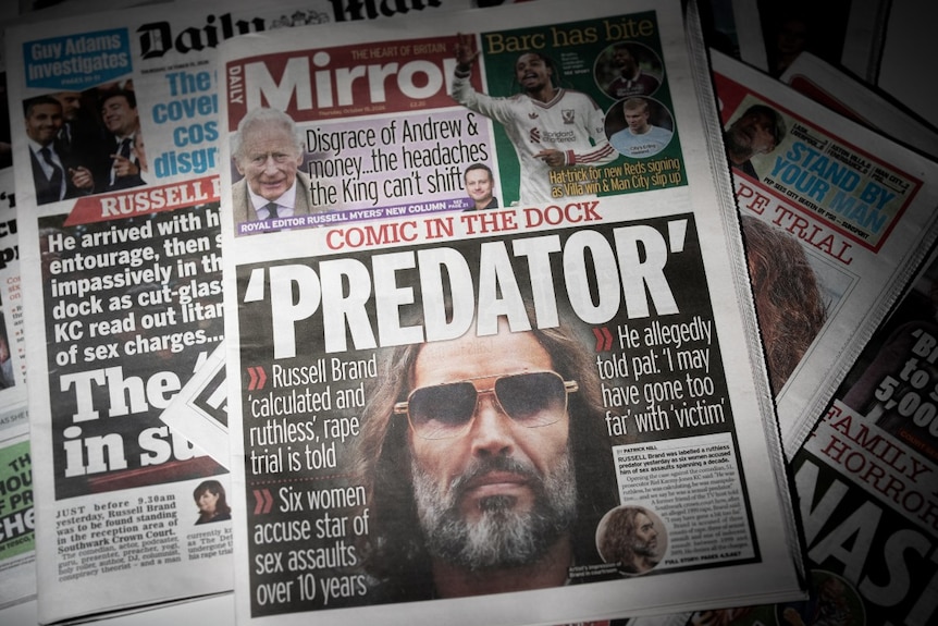 Several front pages of newspapers all carrying the same story.