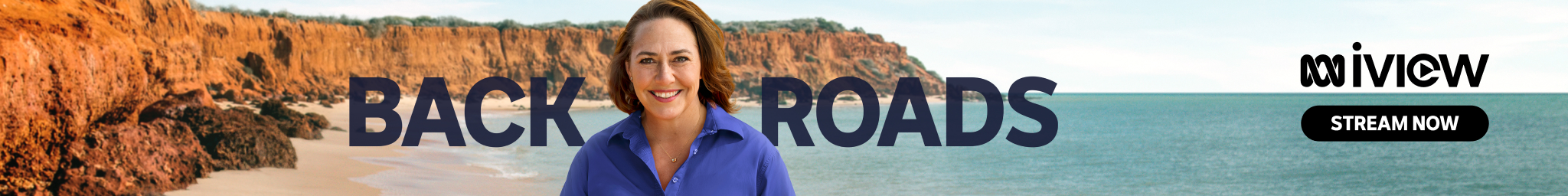 Lisa Millar stands in front of Back Roads branding.