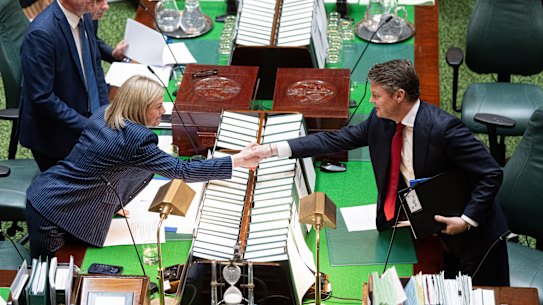 Victorian Premier Ben Carroll shakes hands with Opposition Leader Jess Wilson in parliament after wresting the Labor leadership from Jacinta Allan.