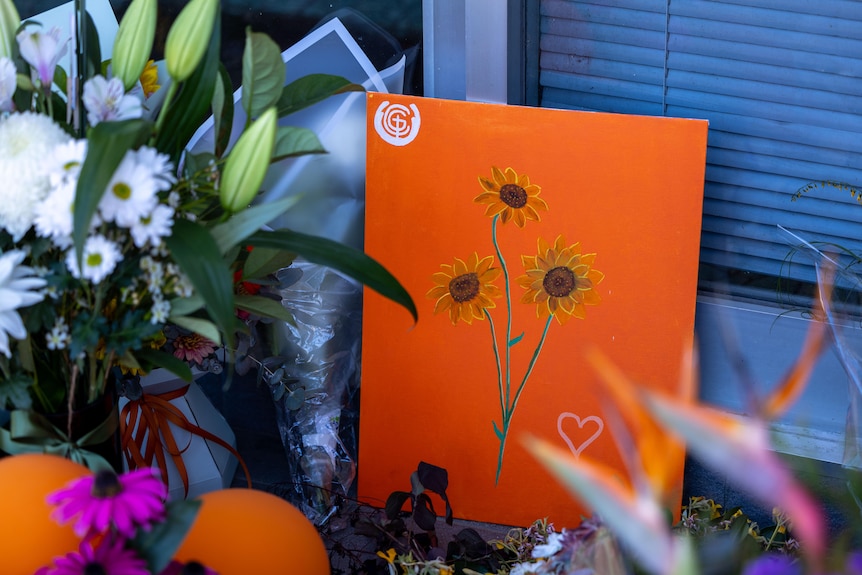 A bright orange, painted card for MP Helen Haines