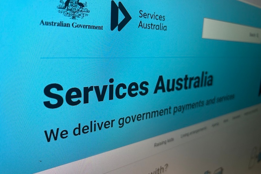 A photo of the Services Australia website with a blue background. 
