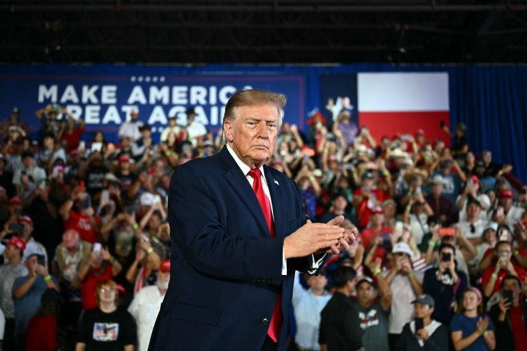 US President Donald Trump applauds after speaking at a midterm campaign rally at the Port of Corpus Christi in Corpus Christi, Texas on October 27, 2026. (Photo by Kent NISHIMURA / AFP)