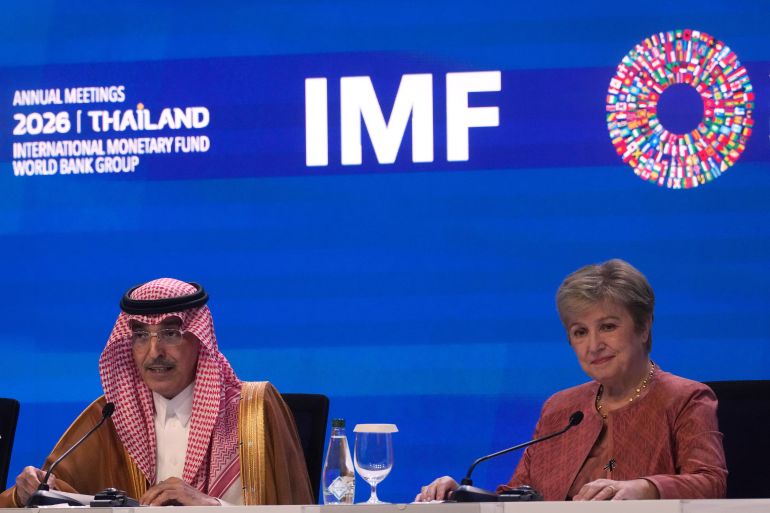 International Monetary and Financial Committee (IMFC) Chair and Saudi Arabia's Finance Minister Mohammed Al-Jadaan, left, speaks as International Monetary Fund (IMF) Managing Director Kristalina Georgieva listens at a news conference following the International Monetary and Financial Committee (IMFC) meeting during the annual meetings of the IMF and the World Bank Group in Bangkok, Thailand, Saturday, Oct. 17, 2026. (AP Photo/Sakchai Lalit)