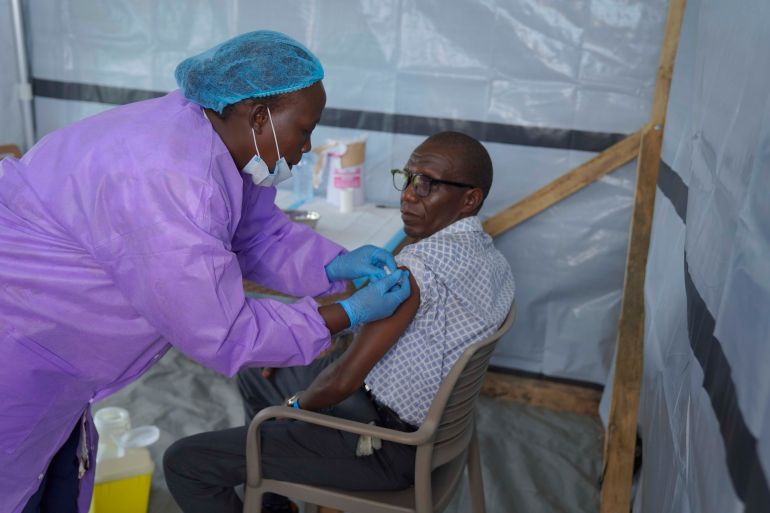 A health workers administers a dose of the Tumaini vaccine against Ebola virus, in Ituri, Congo, Friday, Oct. 23, 2026. (AP Photo/Dieudonne Dirole)