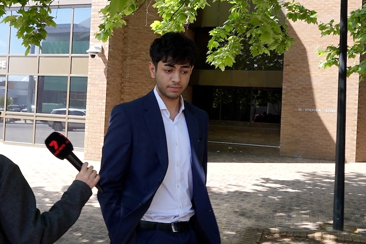 A man in a suit outside court