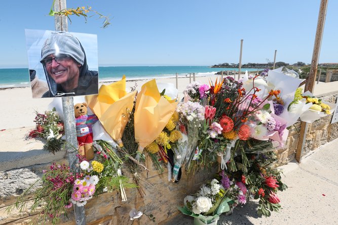 Flowers laid in tribute for shark attack victim Greg O’Neill at Sorrento Beach.
