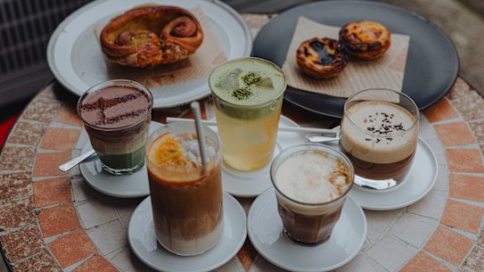 Cups of matcha dreamee, velvet botany, Mudcha, Vietnamese Egg coffee and salted coffee and some pastries.