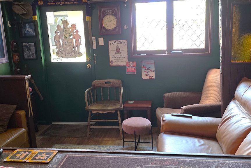 a room with some chairs and a door