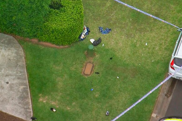 Items left at the scene after a man was shot by police on Thursday.