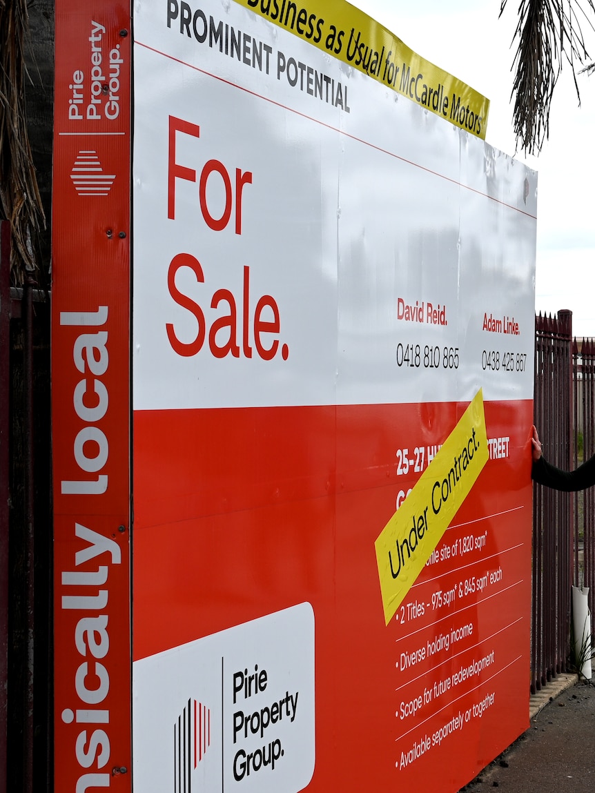 A For Sale sign on the exterior of a property