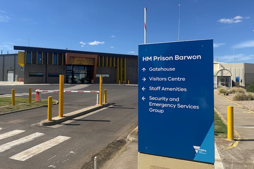 A blue sign out the front of the HM Barwon Prison detailing locations and directions.