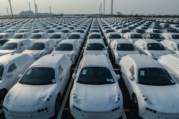 Chinese cars and other export goods are flooding global markets. But it’s not all good news for its economy.