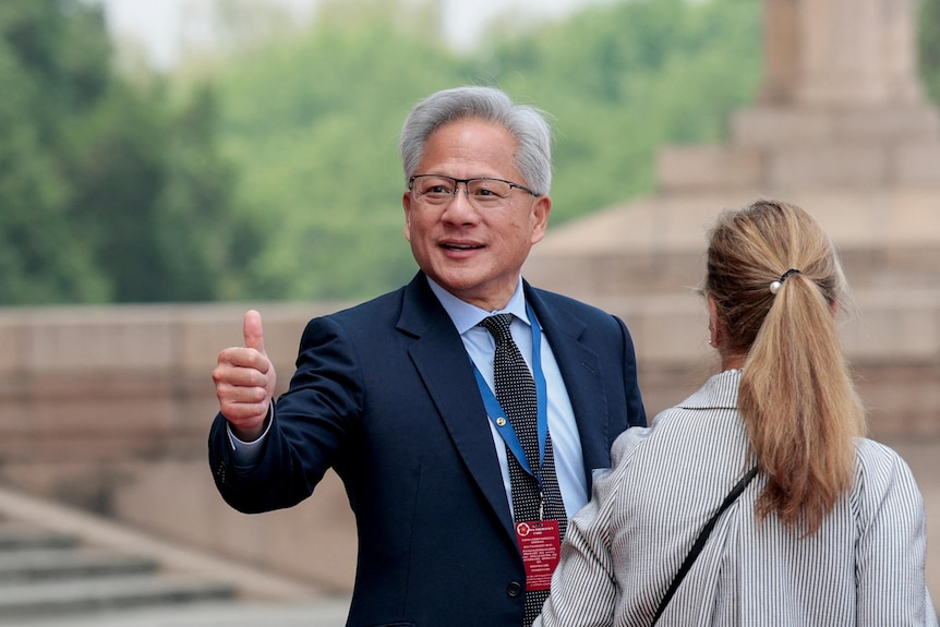 Jensen Huang walks on the red carpet.