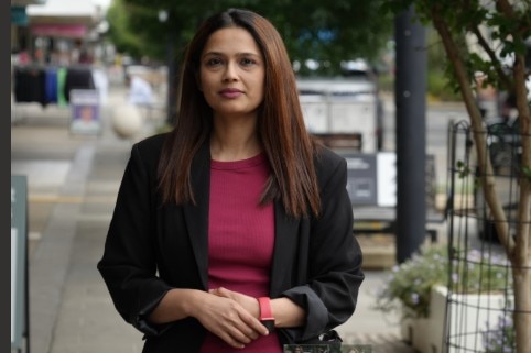 Ethnic Council of Shepparton representative Neha Samar looks towards the camera while standing in the street.