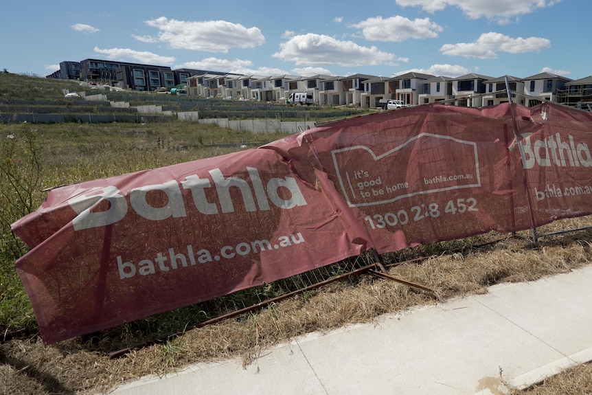 Canvas signage in front of suburban lots under development