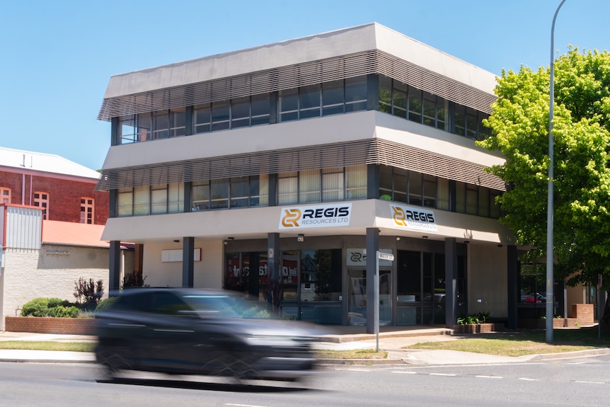 An office building with the sign 'Regis Resources Ltd' on the door and front of the building.