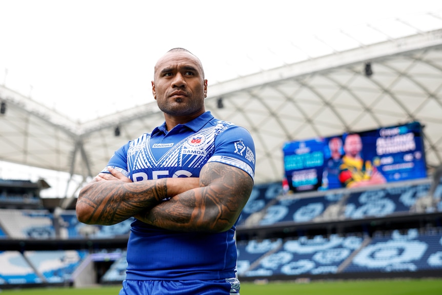 A man poses for a portrait at a rugby league tournament launch 