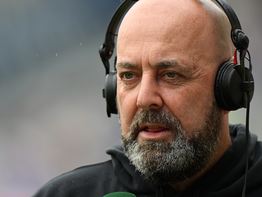 Darren Lehmann, bearded and in headphones, gives his views during a recent game.