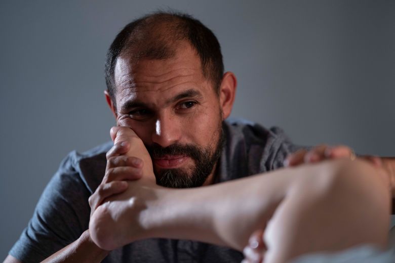 Hugo Verdin comforts his wife, Mayra, as she gives birth over Labor Day weekend.