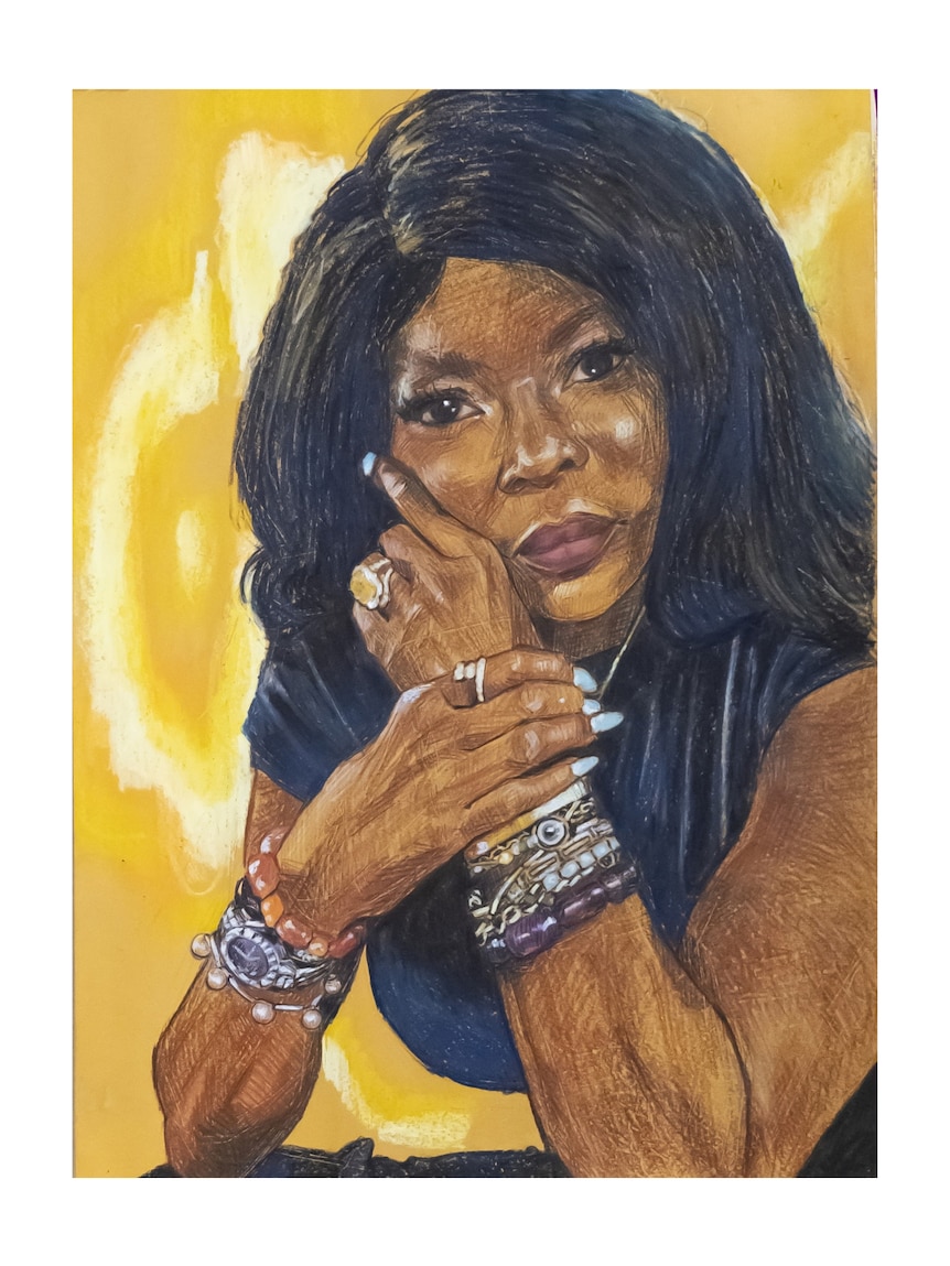 Colourful portrait of Marcia Hines leaning on her elbows, one hand with lots of jewelry held to her face, gold background