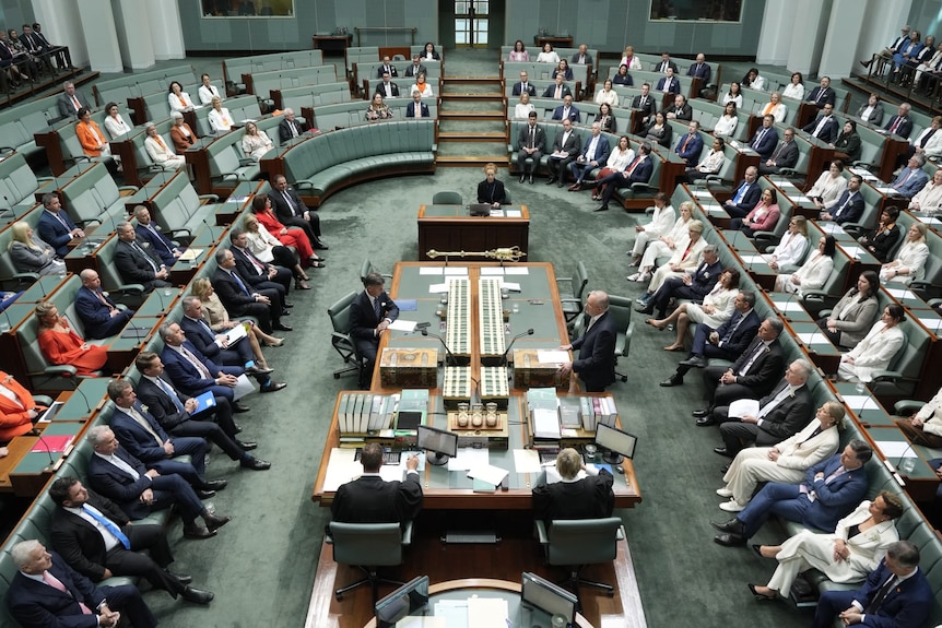 Chamber in House of Representatives showing many wearing orange and white.