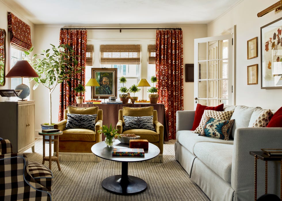 Cozy living room with colorful curtains, plants, and stylish seating arrangements. Cozy living room with colorful curtains, plants, and stylish seating arrangements.