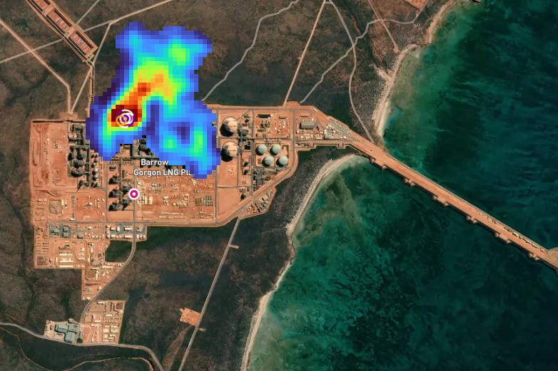 A satellite image of a gas plan with a heat map ranging from deep red to light blue over the centre of the facility.