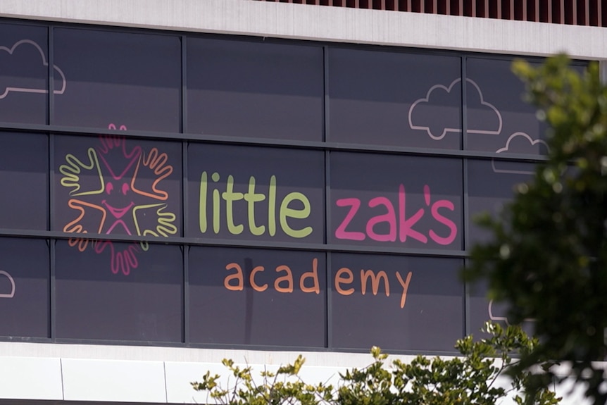 A sign on the exterior of a childcare centre reads "Little Zak's academy".