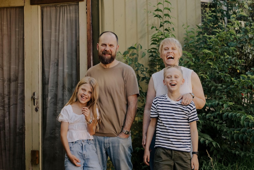 Amanda and her husband Caleb with their two kids