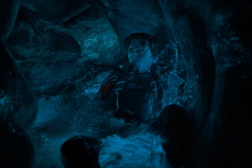 A man in a scuba suit inside a whale stomach