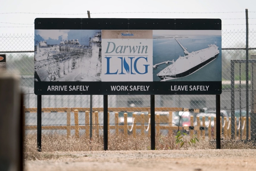 A large sign at the entrance to the gas plant reads "arrive safely, work safely, leave safely"