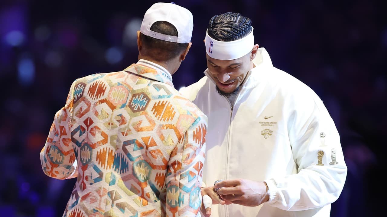 NEW YORK, NEW YORK - OCTOBER 20: Walter "Clyde" Frazier Jr. presents Josh Hart #3 of the New York Knicks his Championship ring during the Ring Ceremony prior to the game between the Philadelphia 76ers and the New York Knicks at Madison Square Garden on October 20, 2026 in New York City. NOTE TO USER: User expressly acknowledges and agrees that, by downloading and or using this photograph, User is consenting to the terms and conditions of the Getty Images License Agreement. (Photo by Sarah Stier/Getty Images)