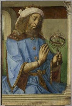 A portrait of a bearded man holding a small globe.
