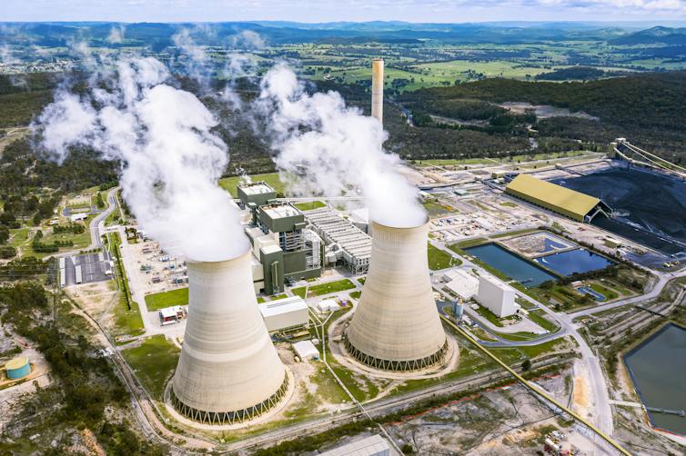A coal power station with clouds of steam.