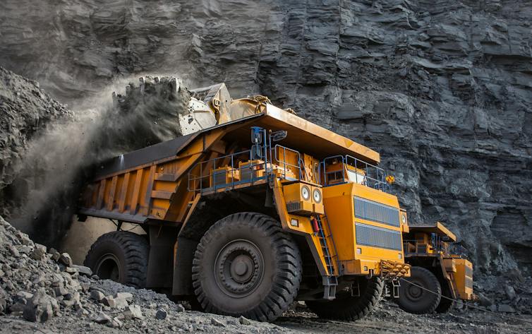 Coal being loaded into a truck at a quarry.