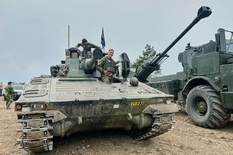 A soldier in a tank.