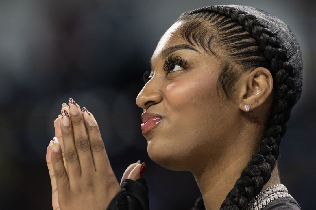 Reese, sporting two long stitch braids while a rookie on the Chicago Sky, claps for her team during a game against the Dallas Wings on September 8, 2024.