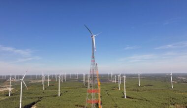 Aerial view of the GICON high-altitude wind turbine in Schipkau, Germany, rising above a wind farm