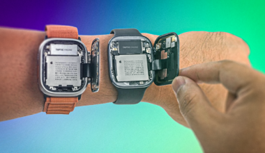 Two open-fronted smartwtches on wrist