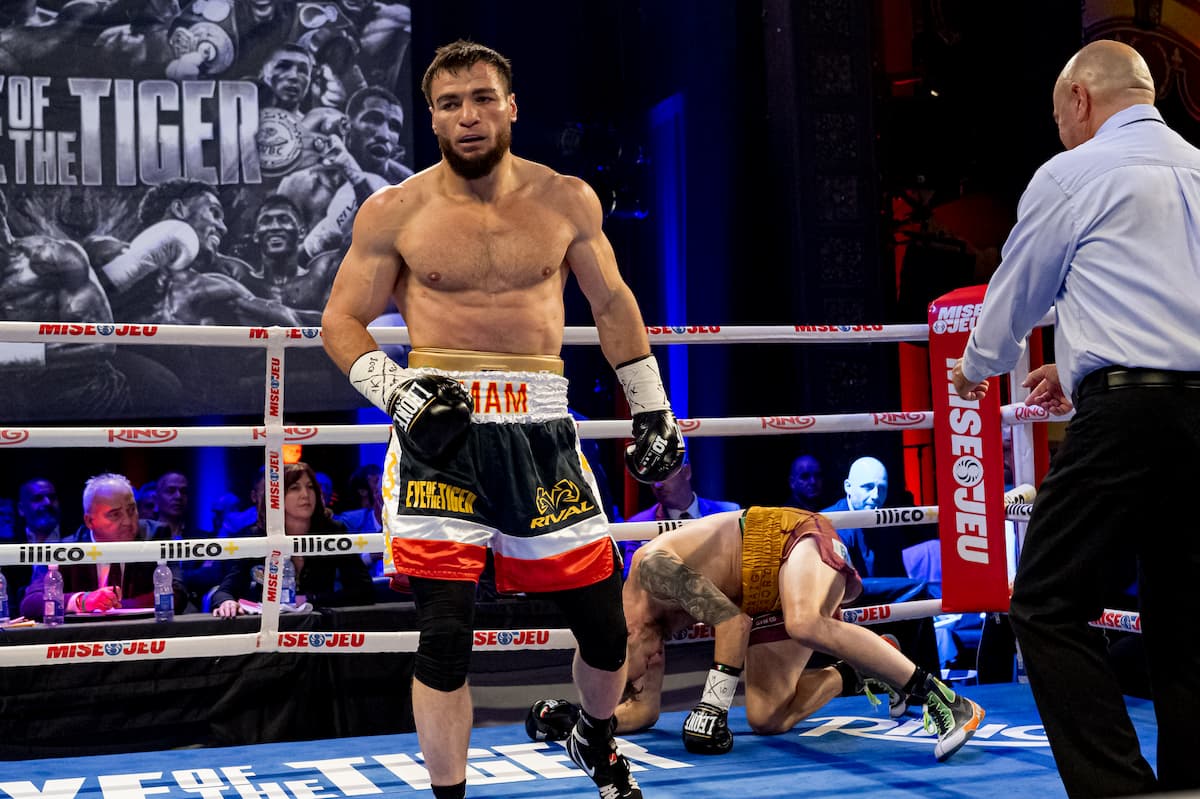 Imam Khataev knocks down Padraig McCrory during their bout