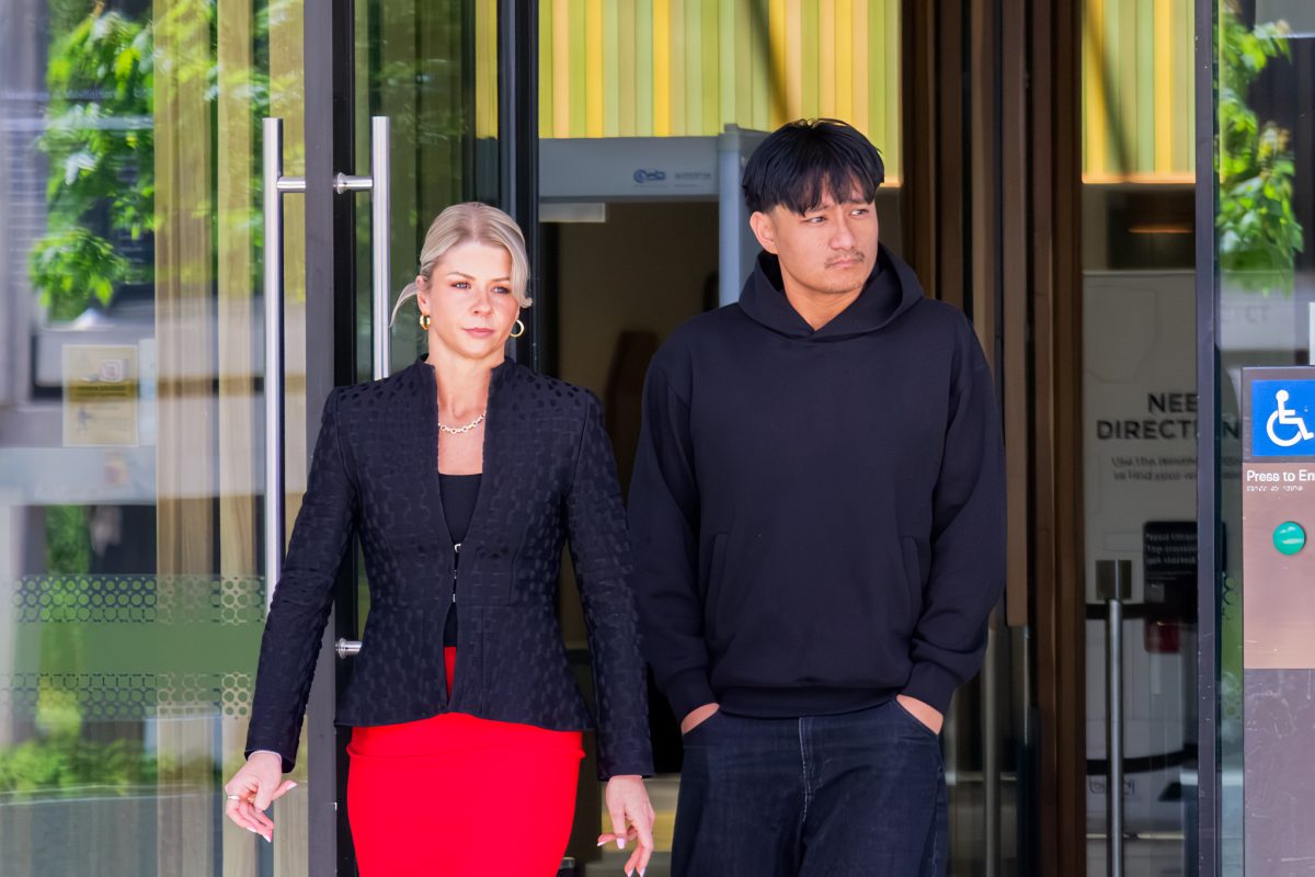 A man leaves court with his lawyer