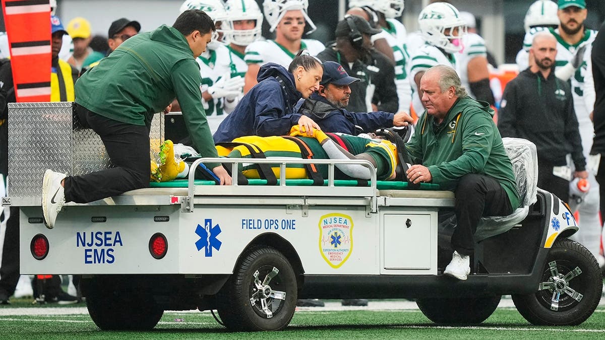 Jayden Reed is taken off the field after an injury during an NFL game against the New York Jets.