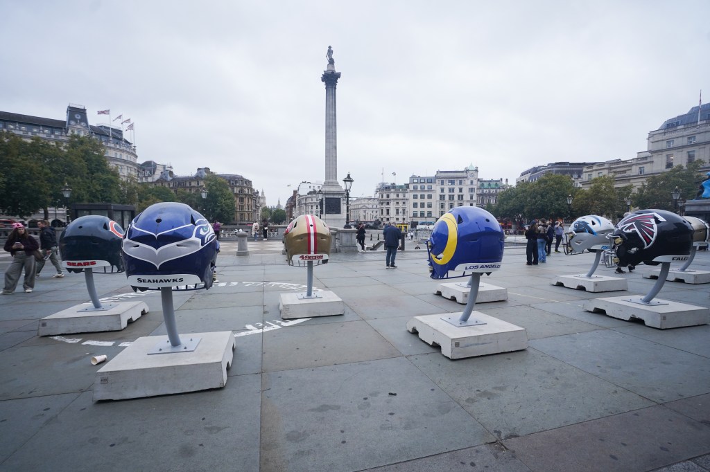 Large NFL team helmets are on display in Trafalgar Square to celebrate the London Games.