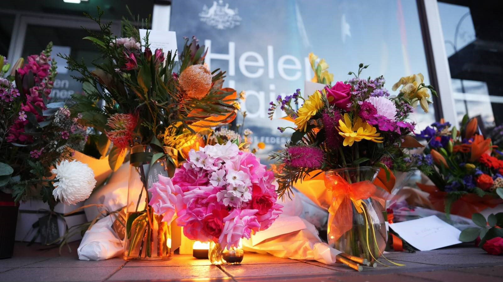 Flowers and candles positioned outside Helen Haines's office.